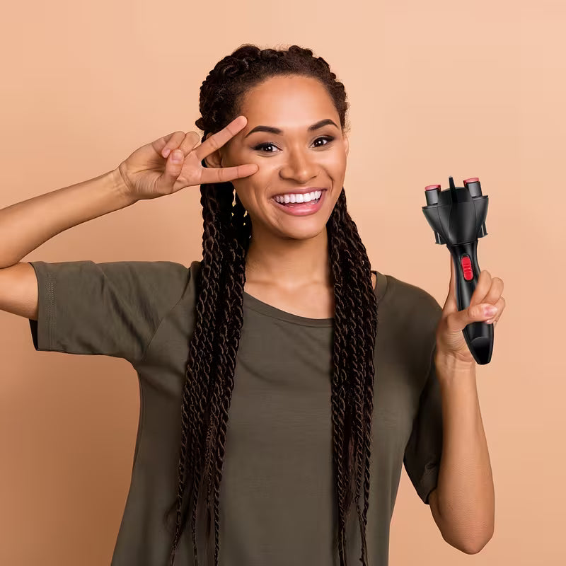 Woman with braided hair holding a hair straightener against a beige background